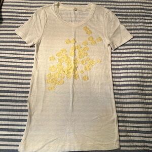 Cream colored J Crew TSHIRT with raised yellow floral design